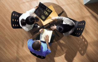 Photo of office staff managers collaborating for change in their organization